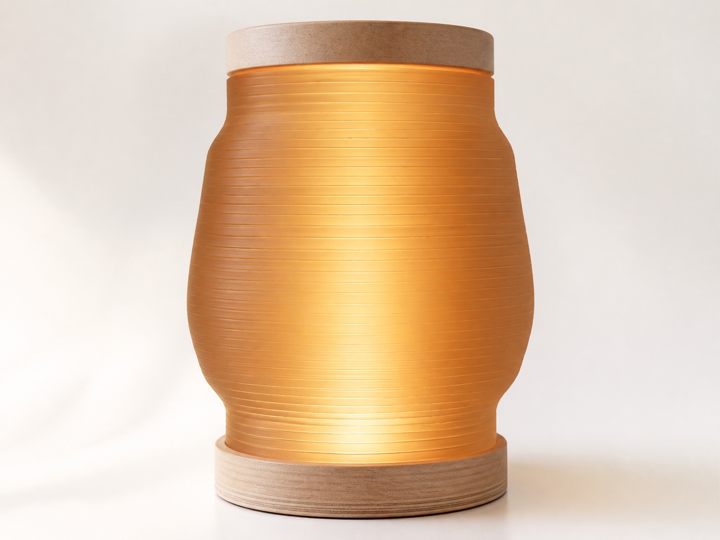 Warm translucent Apollo lampshade finished with a layered Baltic-birch cap and base