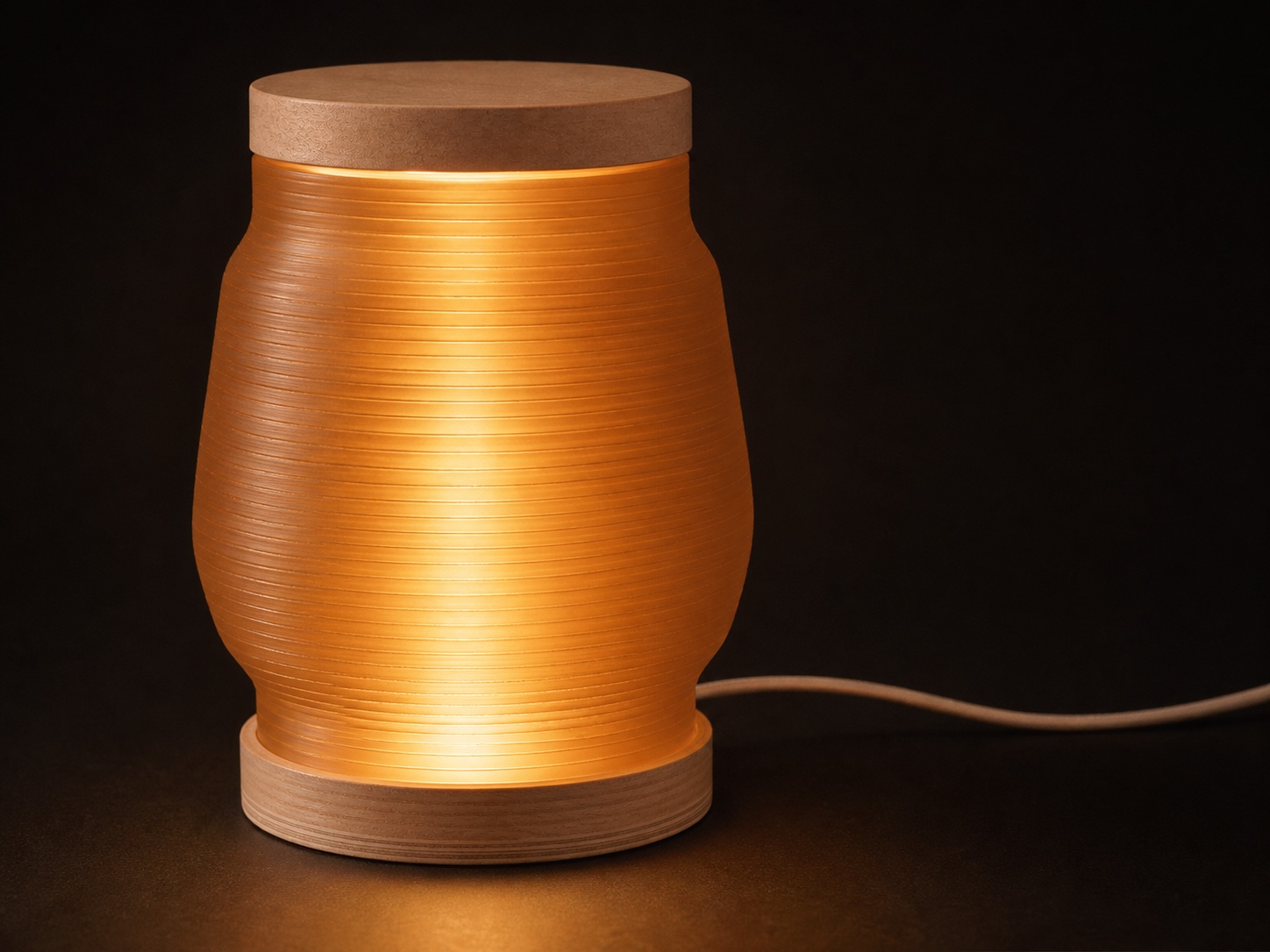 Apollo lamp glowing warmly from within with a discreet USB-C power cable